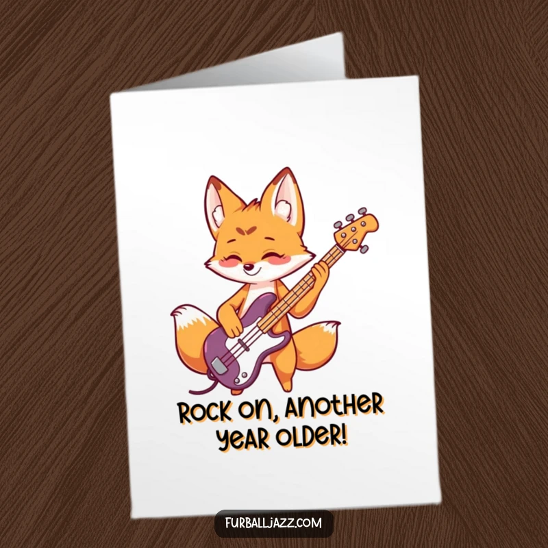 Funny Free Printable Fox Birthday Card: Playful fox character rocking out on a bass guitar, wishing a happy birthday.