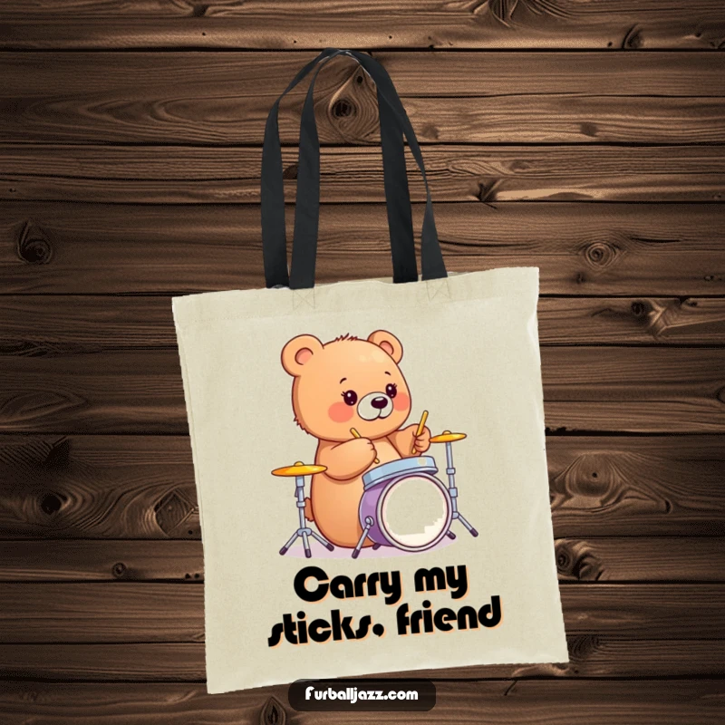 Funny bear cub happily tapping drumsticks on a miniature drum set, a humorous tote for music lovers.